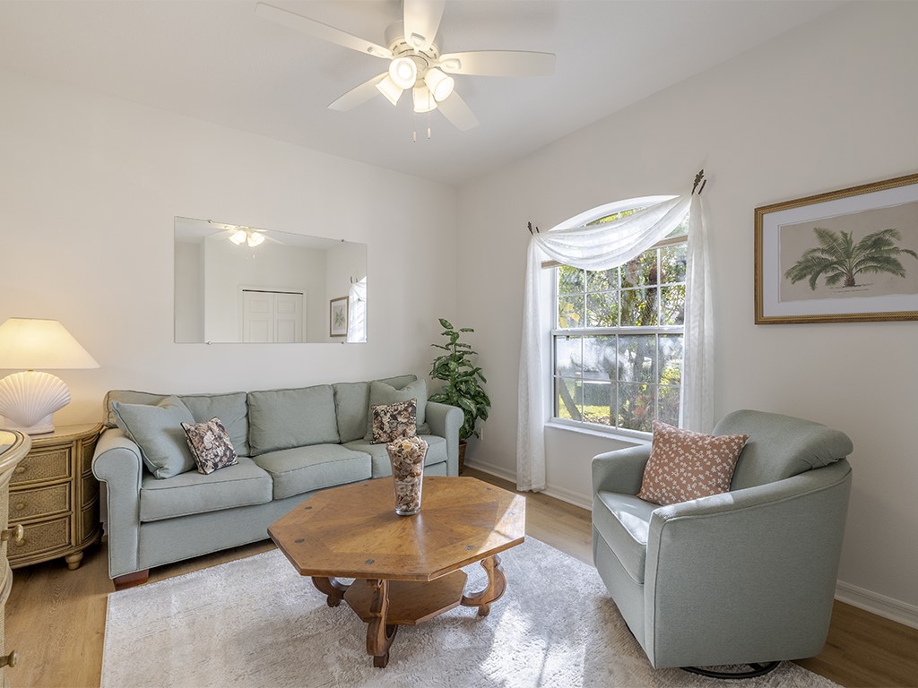 3648 2nd Street Southwest Vero Beach, FL 32968 - Photo 13 of 36 a living room with furniture and a large window