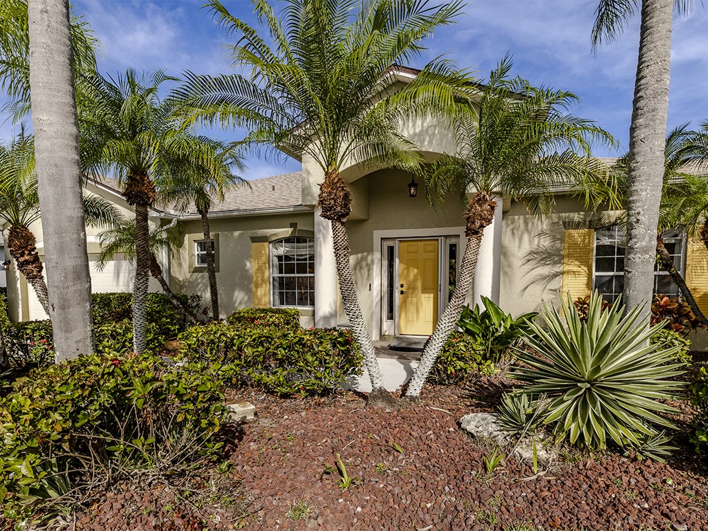 3648 2nd Street Southwest Vero Beach, FL 32968 - Photo 15 of 36 a front view of a house with a tree
