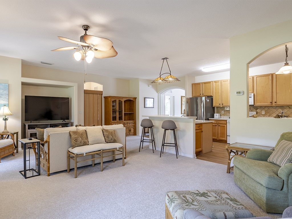 3648 2nd Street Southwest Vero Beach, FL 32968 - Photo 2 of 36 a living room with furniture and a flat screen tv