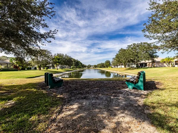 a view of a lake with a house in the background