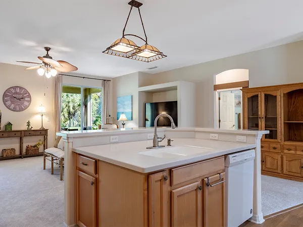 a view of a center island and chandelier