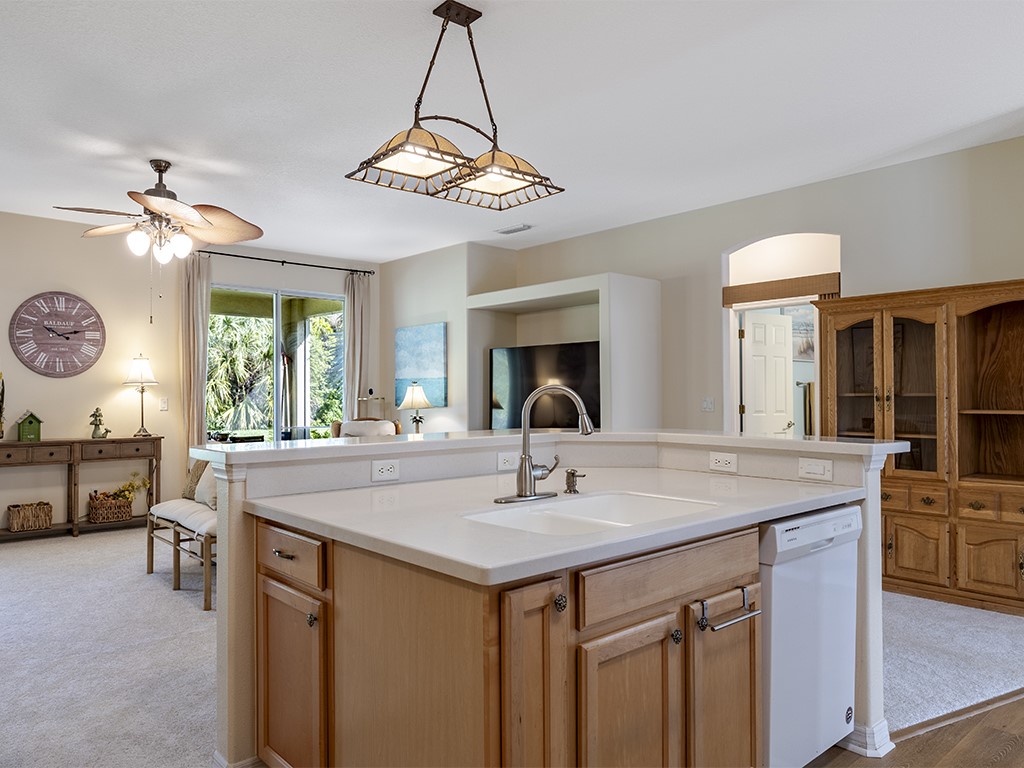 3648 2nd Street Southwest Vero Beach, FL 32968 - Photo 10 of 36 a view of a center island and chandelier