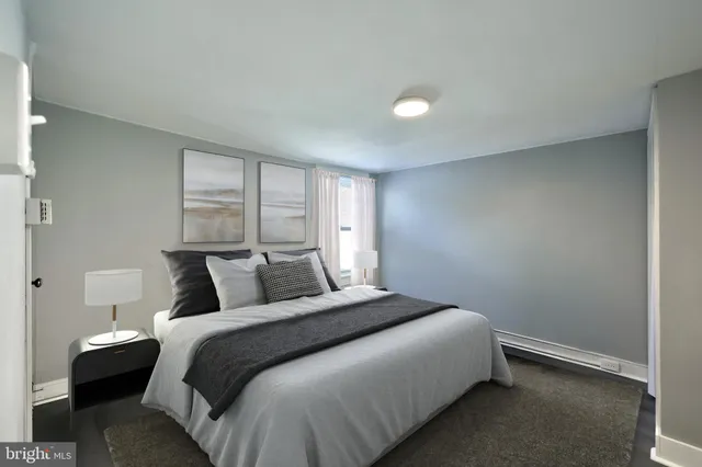 a bedroom with a bed and window