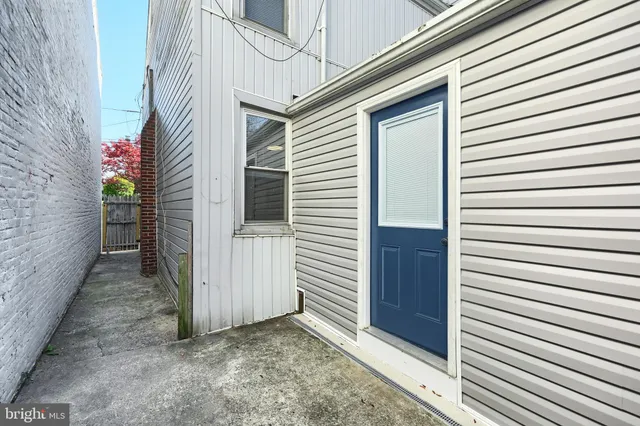 a view of a house with wooden walls