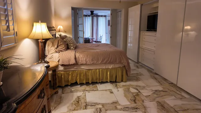 a bed room with a bed and a night stand