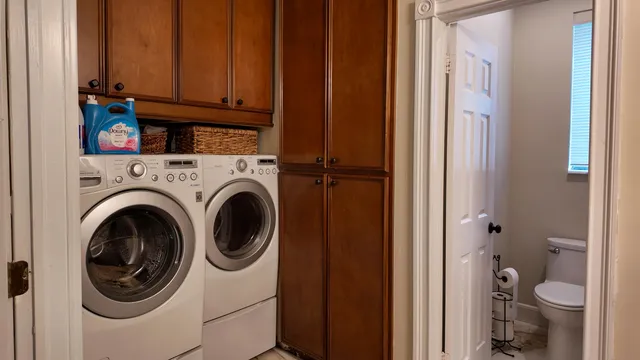 a view of bathroom with a washer and dryer