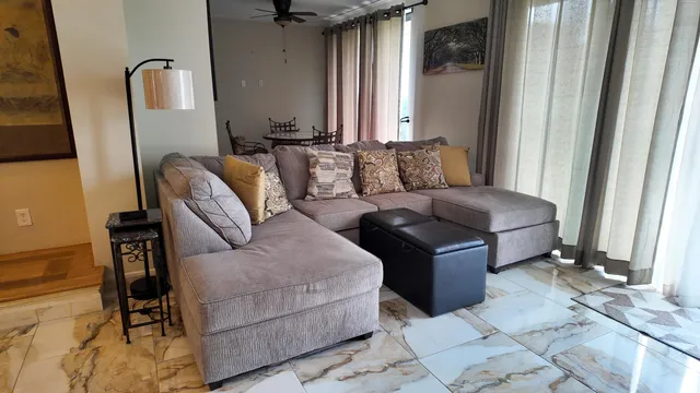 a living room with furniture and a window