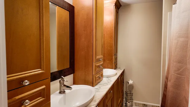 a bathroom with a sink and a mirror