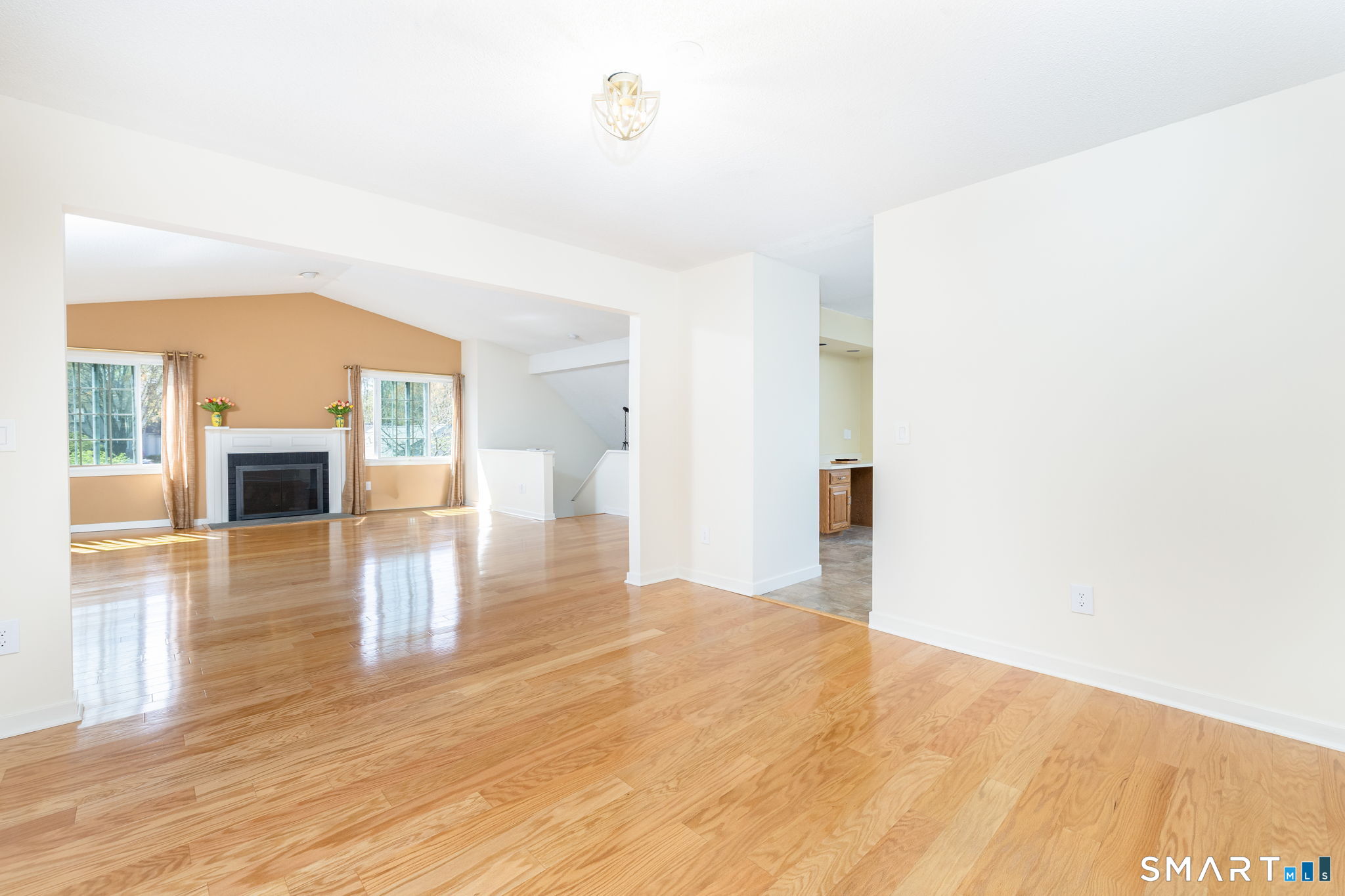 85 Gate Ridge Road, Unit 85 Fairfield, CT 06825 - Photo 11 of 38 a view of empty room with wooden floor