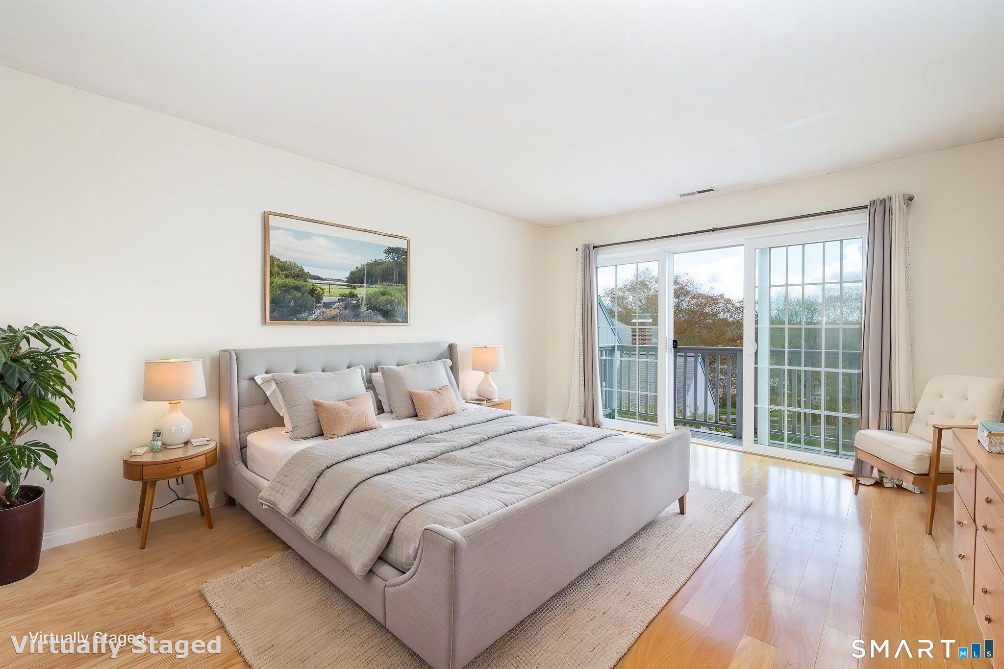 85 Gate Ridge Road, Unit 85 Fairfield, CT 06825 - Photo 12 of 38 a spacious bedroom with a large bed and a large window