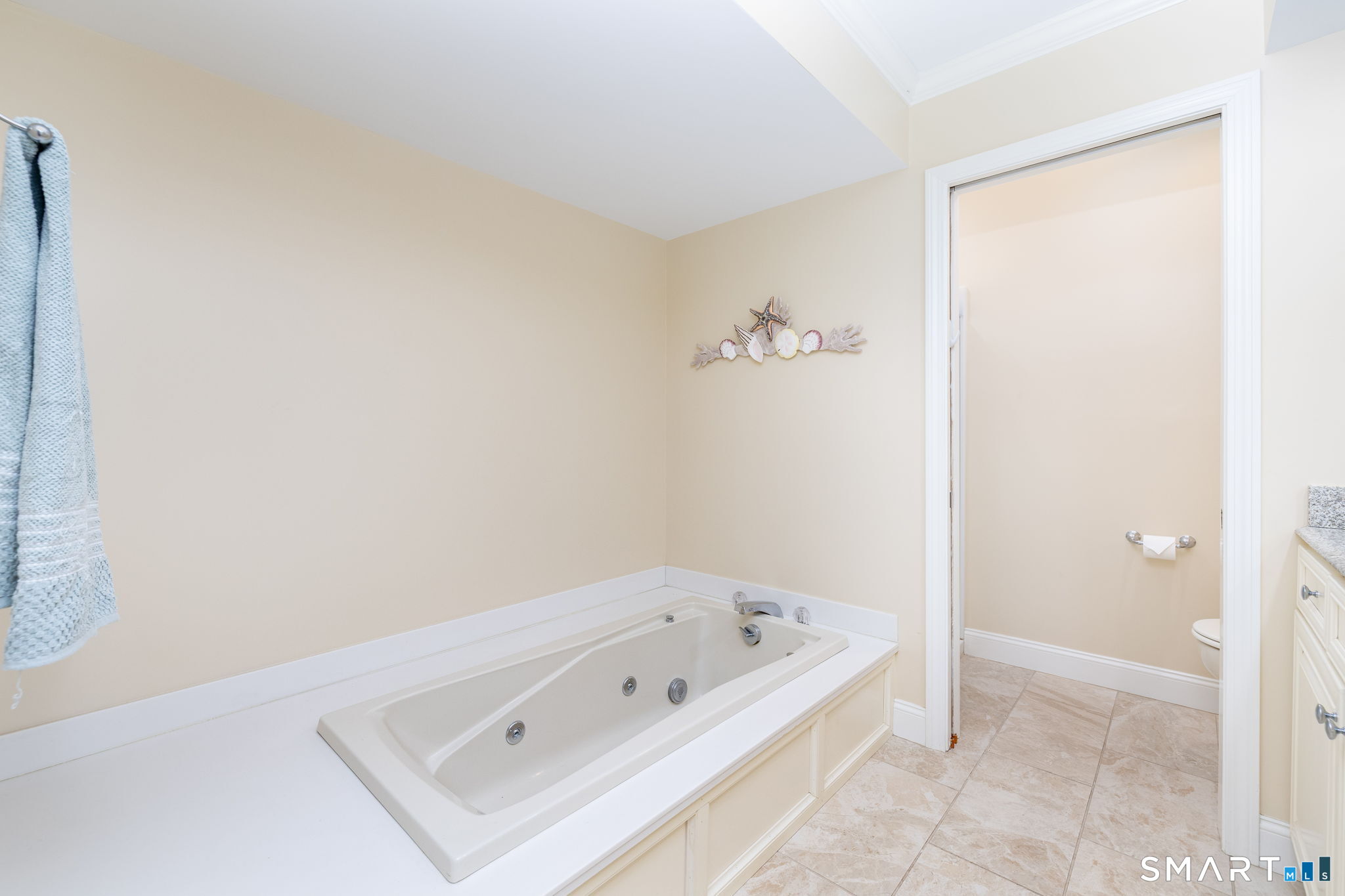 85 Gate Ridge Road, Unit 85 Fairfield, CT 06825 - Photo 16 of 38 a bathroom with a bathtub and shower