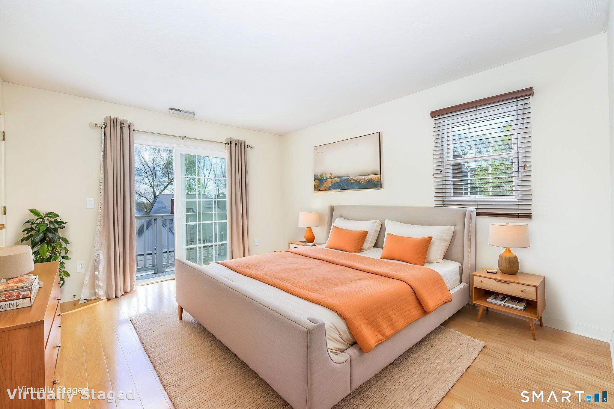 85 Gate Ridge Road, Unit 85 Fairfield, CT 06825 - Photo 19 of 38 a bedroom with a large bed and a large window