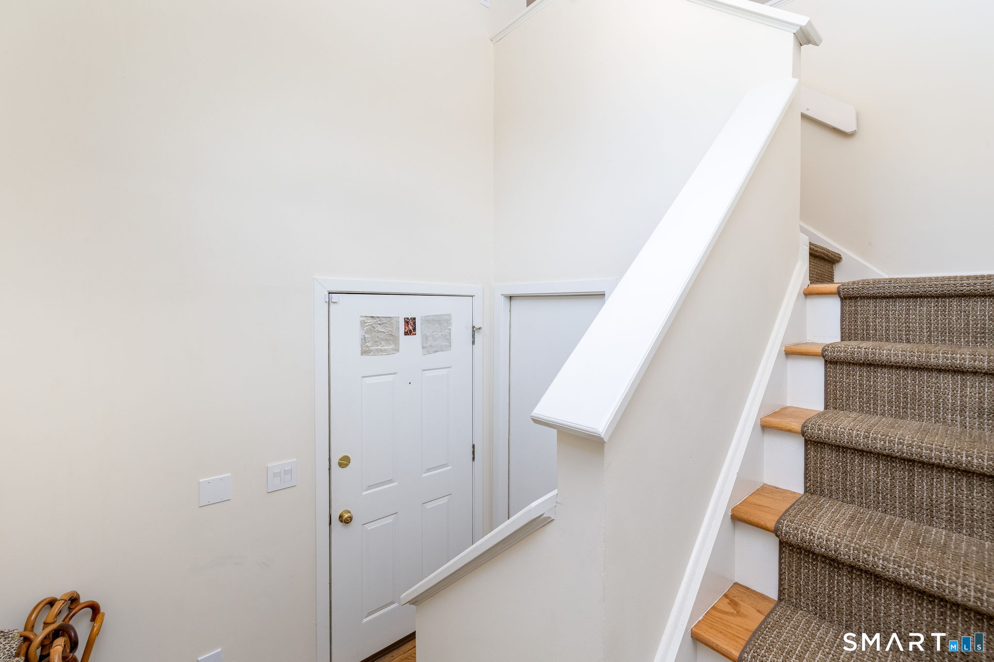 85 Gate Ridge Road, Unit 85 Fairfield, CT 06825 - Photo 27 of 38 a view of staircase with white walls and railing