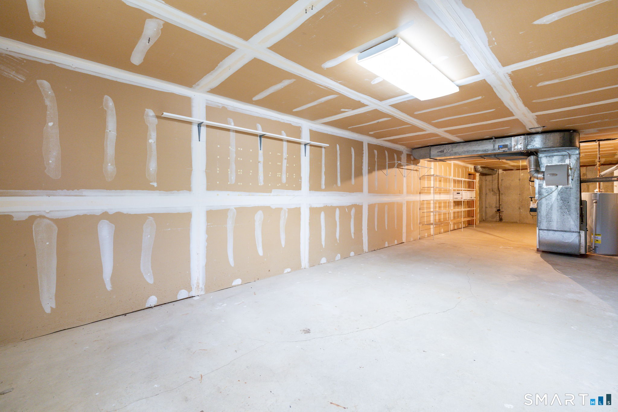 85 Gate Ridge Road, Unit 85 Fairfield, CT 06825 - Photo 29 of 38 a view of an empty room with wooden walls