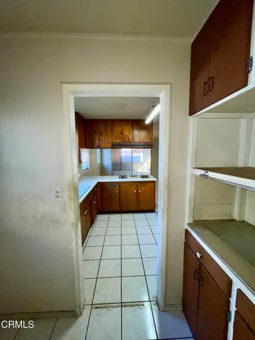 a view of empty room with closet and wooden floor