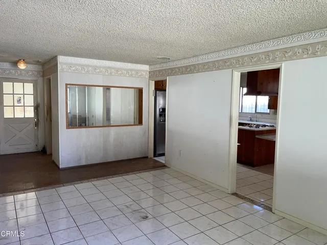 a kitchen with wooden cabinets and a stove top oven