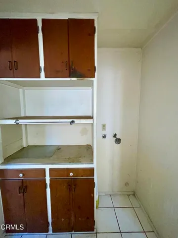 a white toilet sitting next to a small sink