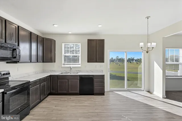 a white toilet sitting next to a white sink
