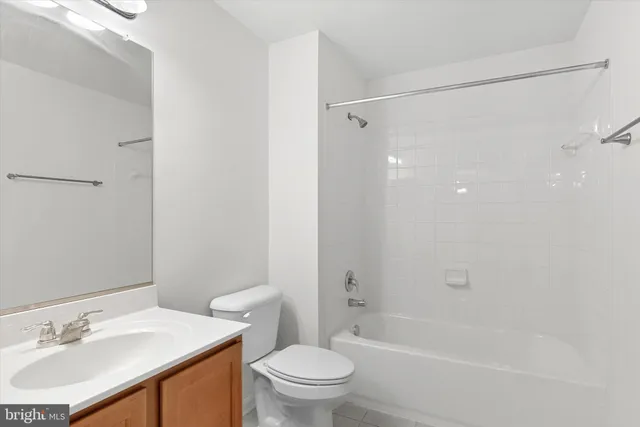 a bathroom with a sink vanity and a mirror