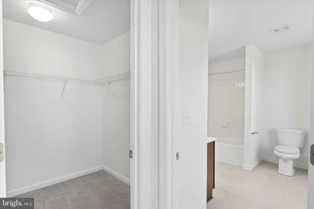a bathroom with a sink vanity and a mirror