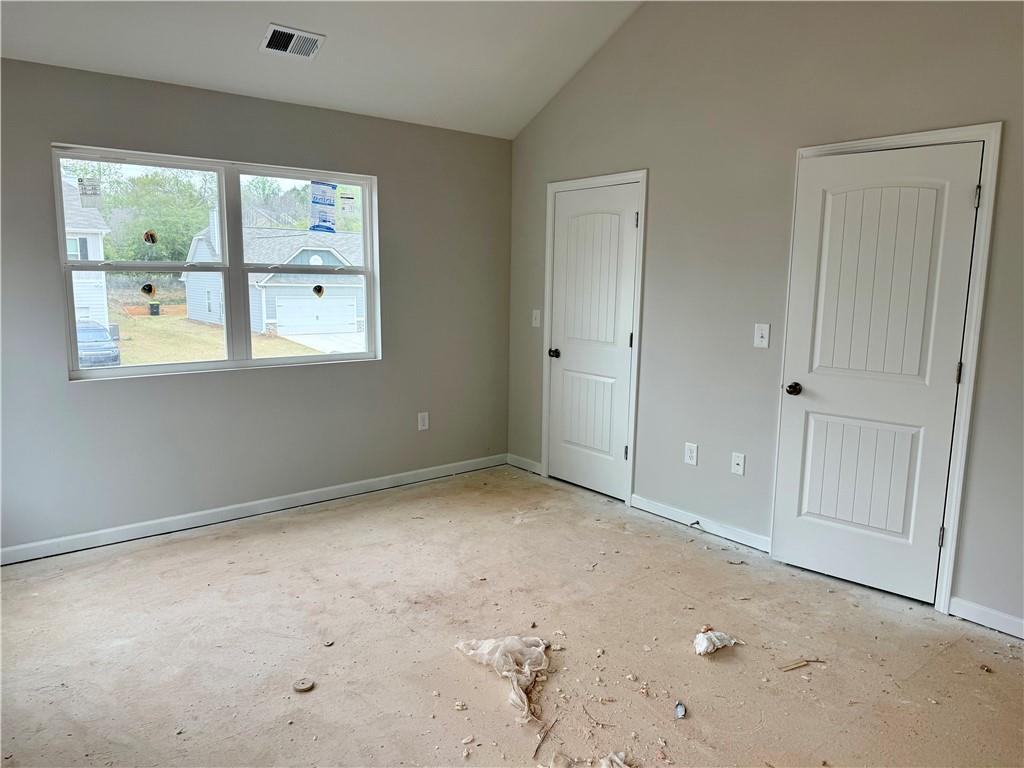 501 Charleston Place Villa Rica, GA 30180 - Photo 12 of 18 an empty room with windows