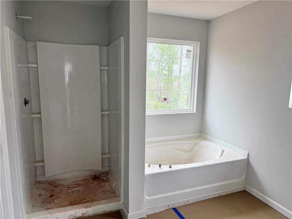 501 Charleston Place Villa Rica, GA 30180 - Photo 14 of 18 a white bath tub sitting next to a window