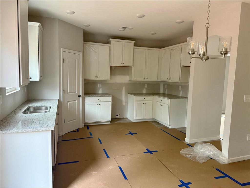 501 Charleston Place Villa Rica, GA 30180 - Photo 5 of 18 a kitchen with a sink appliances and cabinets