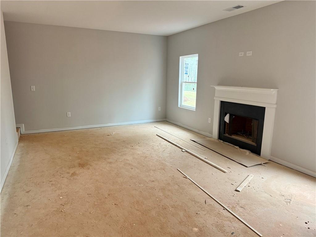 501 Charleston Place Villa Rica, GA 30180 - Photo 6 of 18 an empty room with windows