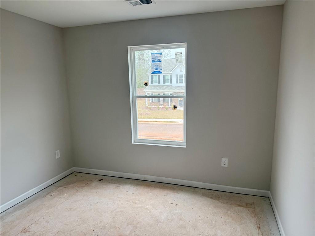 501 Charleston Place Villa Rica, GA 30180 - Photo 8 of 18 a view of an empty room with a window