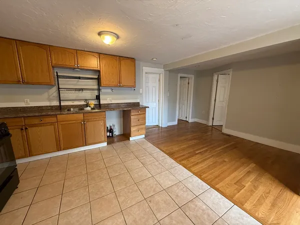 a kitchen with stainless steel appliances granite countertop a sink counter space cabinets and a sink