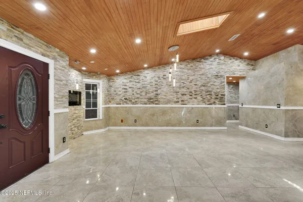 a view of a bathroom with a tub and shower