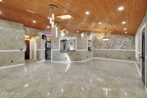 a view of a hallway with a refrigerator