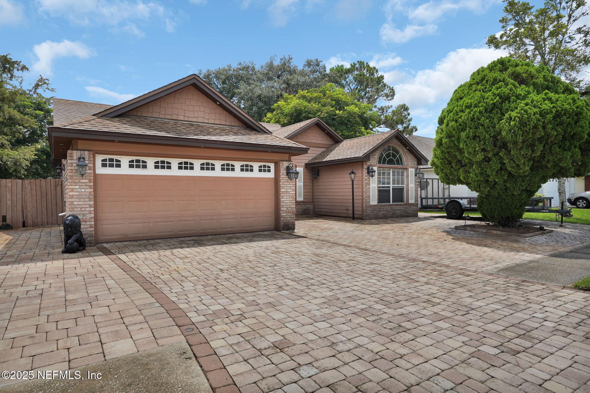 8786 Spring Harvest Lane East Jacksonville, FL 32244 - Photo 2 of 39 a front view of a house with a yard and garage