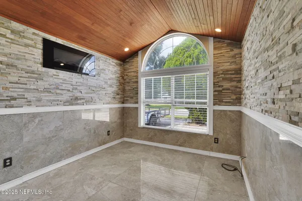 a view of livingroom with furniture and flat screen tv