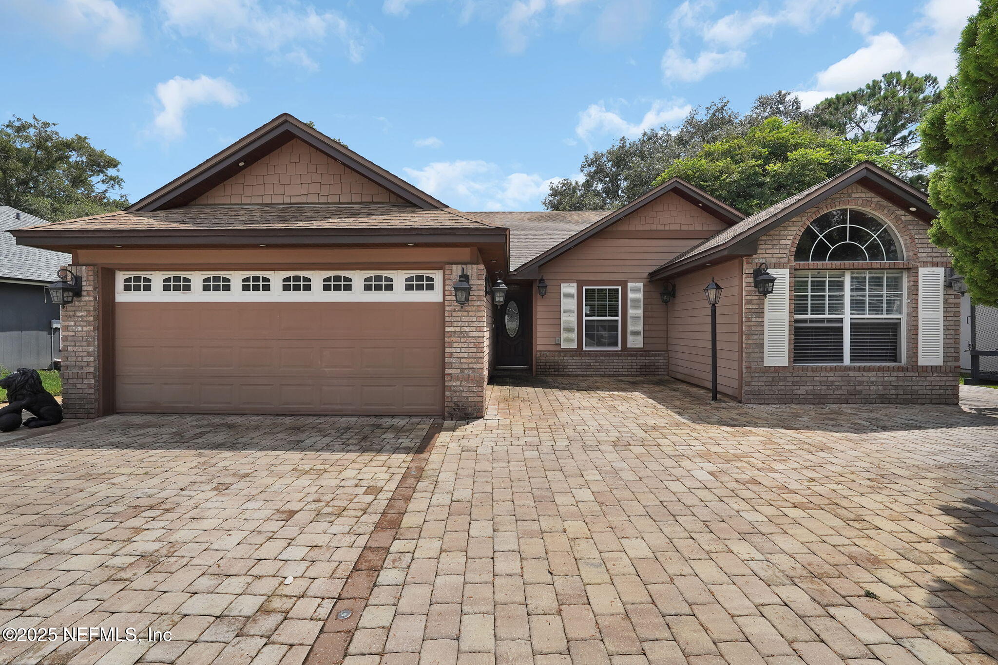 8786 Spring Harvest Lane East Jacksonville, FL 32244 - Photo 3 of 39 a front view of a house with a garden