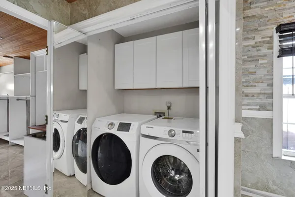 a utility room with dryer and washer