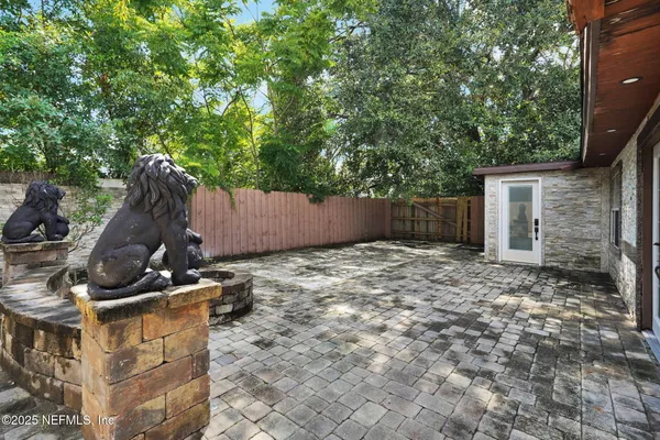 a backyard of a house with a tree