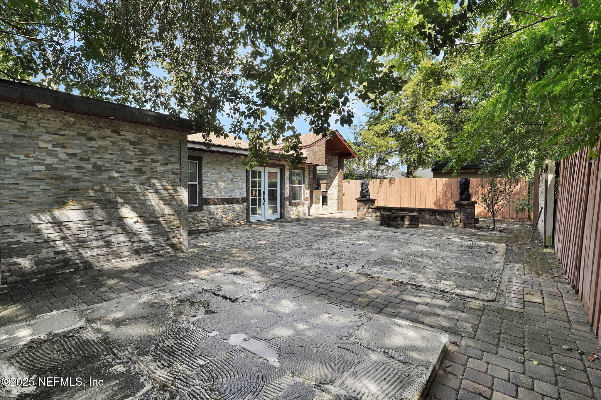 8786 Spring Harvest Lane East Jacksonville, FL 32244 - Photo 37 of 39 a wooden bench sitting in front of a house