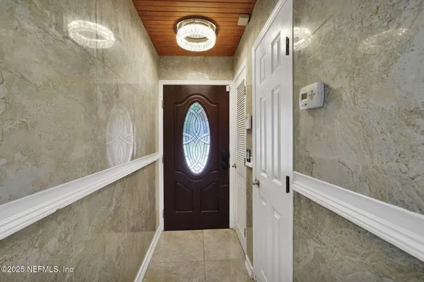 a view of a hallway with entryway