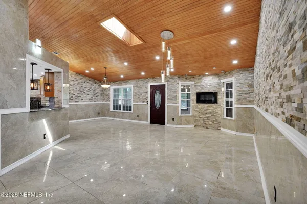 a view of a kitchen with a sink and an oven