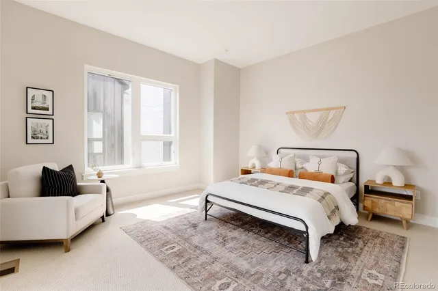 a bedroom with a bed and a couch