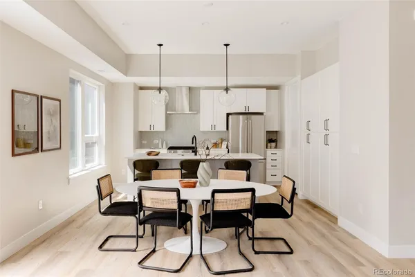a view of a dining room with furniture window and wooden floor