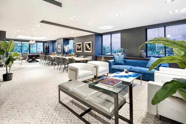 a living room with furniture fireplace and a table