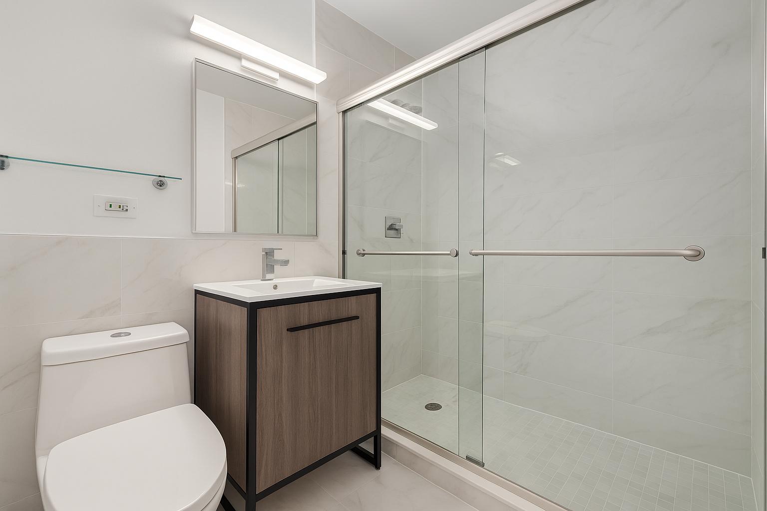 1735 York Avenue, Unit PH35D Manhattan, NY 10128 - Photo 8 of 24 a bathroom with a toilet sink and shower