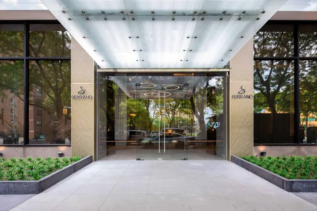 a bathroom with a toilet sink and shower
