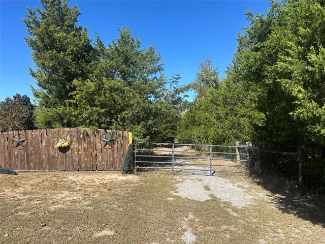 a view of outdoor space with deck and tree