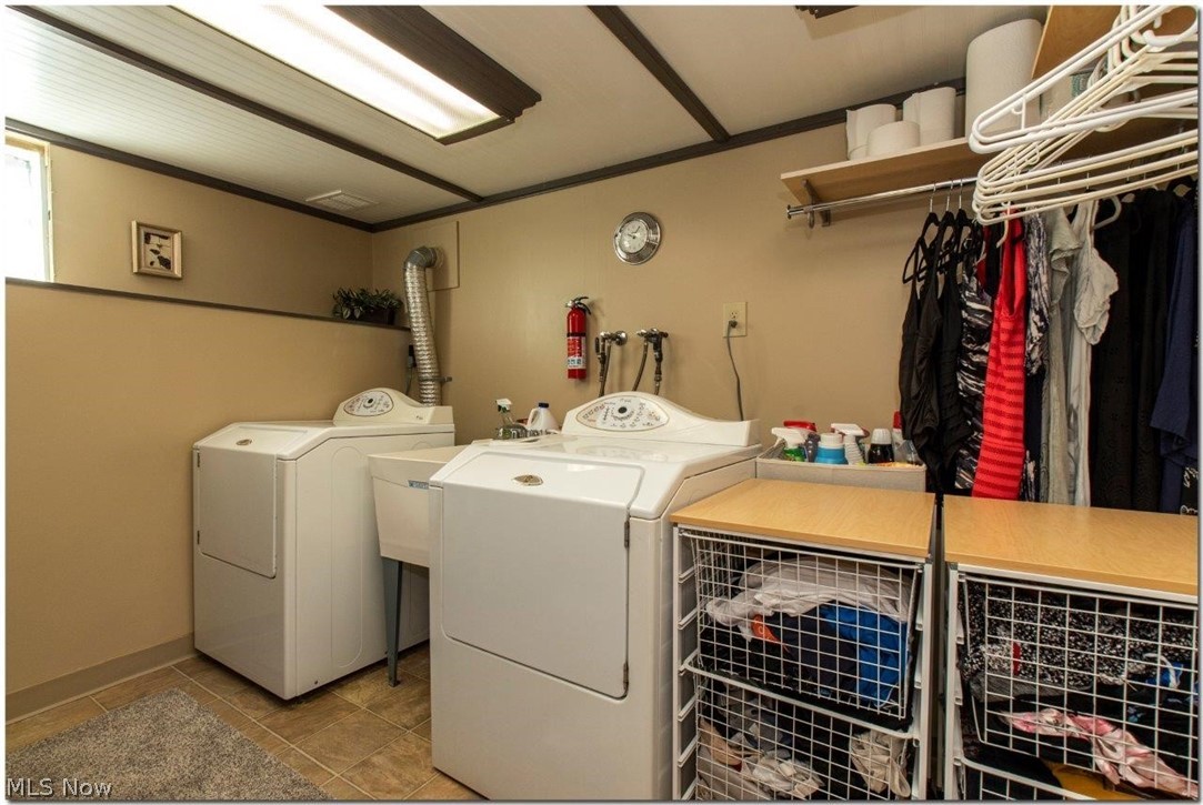 4660 Liberty Road South Euclid, OH 44121 - Photo 29 of 35 Laundry Room with Extensive Shelving System and storage Solutions