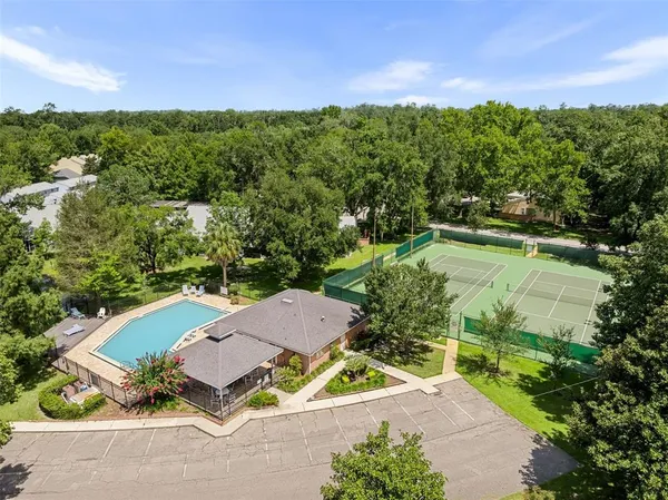 an aerial view of a house with a yard