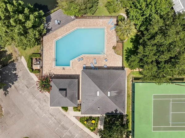 an aerial view of a house with a yard