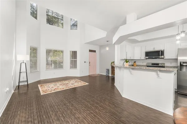 a view of kitchen with cabinets and wooden floor